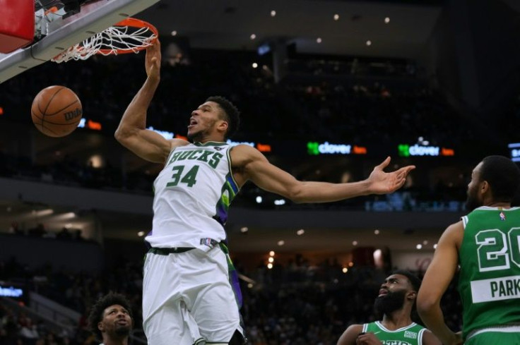 Back in action: Milwaukee's Giannis Antetokounmpo scores in the Bucks' come-from-behind NBA victory over the Boston Celtics