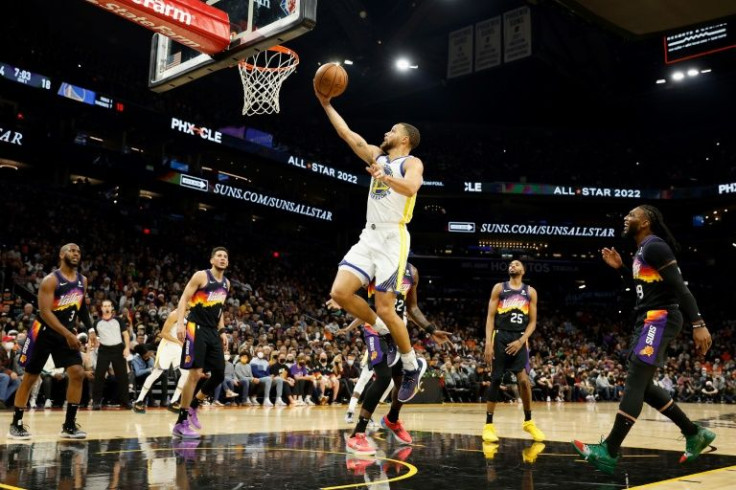 Golden State star Stephen Curry rises for a layup in the Warriors' 117-113 NBA victory over the Phoenix Suns