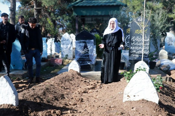 A woman pays her last respects at the funeral