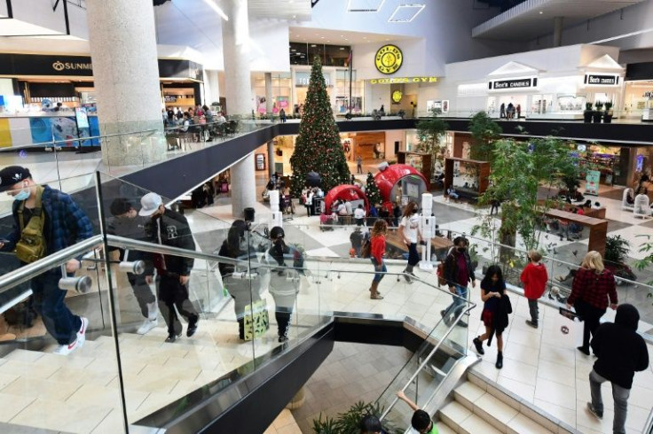 People shop at a mall in Santa Anita, California on December 20, 2021