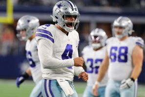 Dallas quarterback Dak Prescott reacts after a touchdown in the second quarter of the Cowboys' 56-14 NFL victory over the Washington Football Team