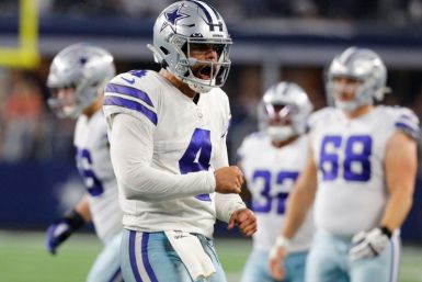 Dallas quarterback Dak Prescott reacts after a touchdown in the second quarter of the Cowboys' 56-14 NFL victory over the Washington Football Team
