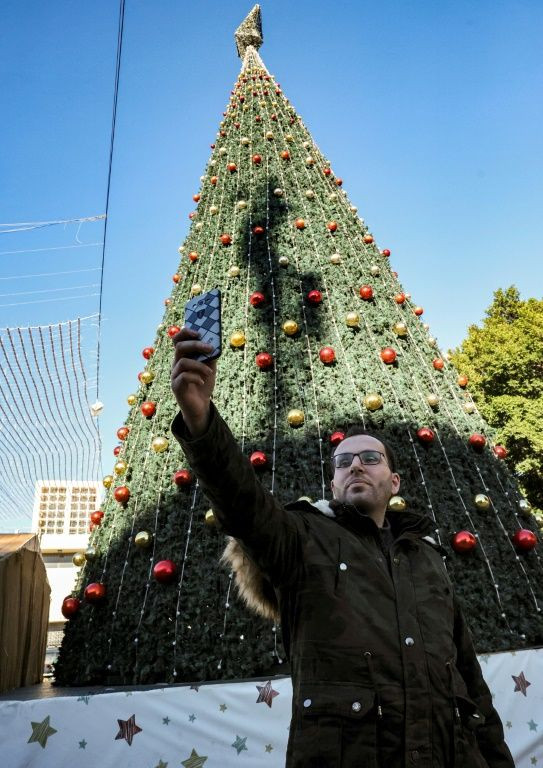 Ayyad, taking a "selfie" in Manger Square, says that unlike his home in war-scarred Gaza, Bethlehem is full of joy