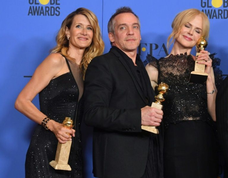 Director Jean-Marc Vallee and actors Laura Dern (L) and Nicole Kidman pose with awards at the 75th Golden Globe Awards ceremony in Beverly Hills, California in January 2018