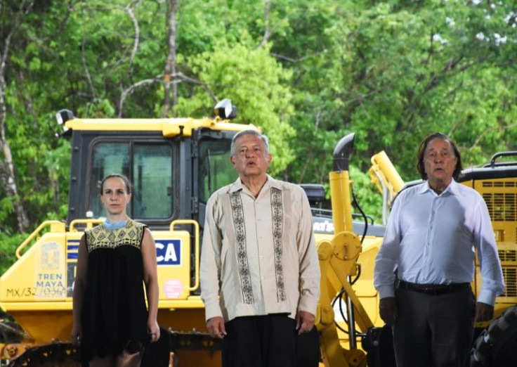 Mexican President Andres Manuel Lopez Obrador (C) brought Slim onboard his flagship project, the Maya tourist train