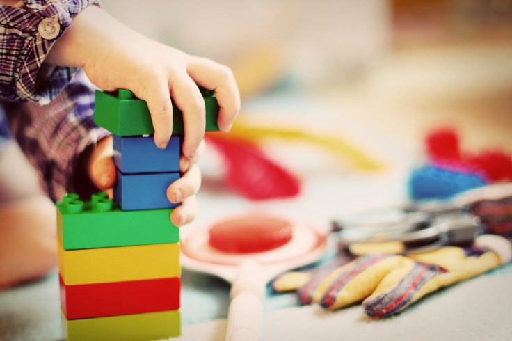 Child Playing With Wooden Blocks