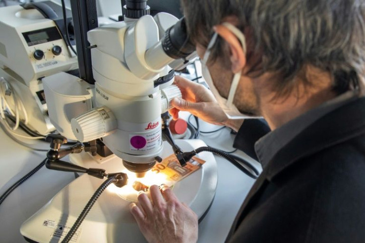 European Central Bank experts spot fake euro notes with 3D microscopes, ultra-sensitive scales and special devices