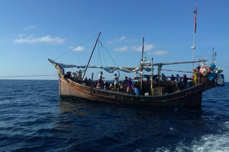 At least 100 mostly women and children aboard a sticken wooden vessel off Aceh province were denied refuge in Indonesia