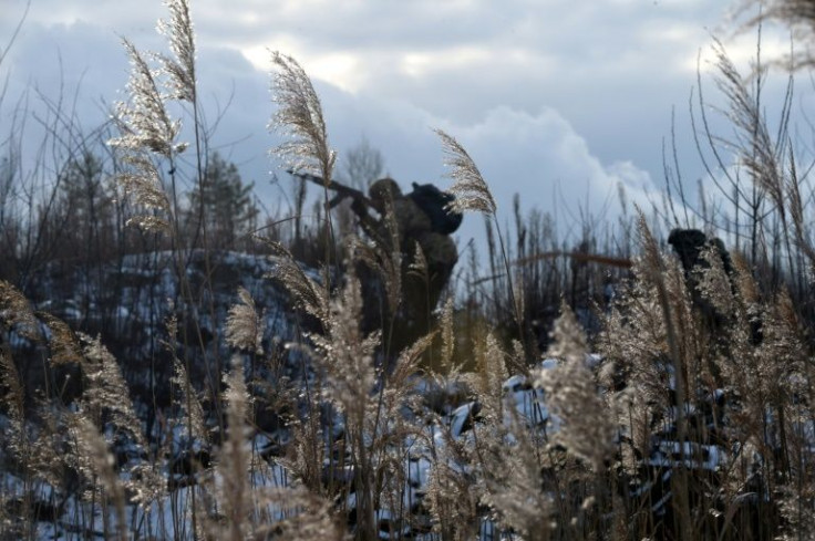 A soldier from the Ukrainian Territorial Defense Forces, the military reserve of the Ukrainian Armed Forces, takes part in an  exercise near Kiev on December 25, 2021