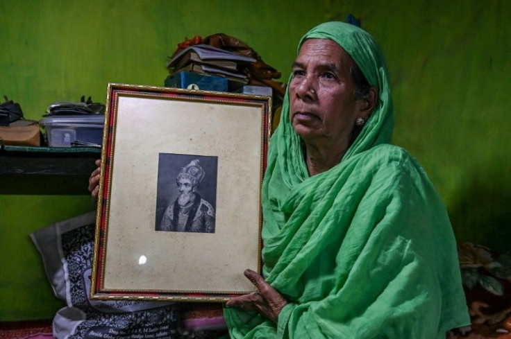 Sultana Begum holds a picture of the last Mughal emperor, Shah Zafar, which she keeps in her Kolkata home