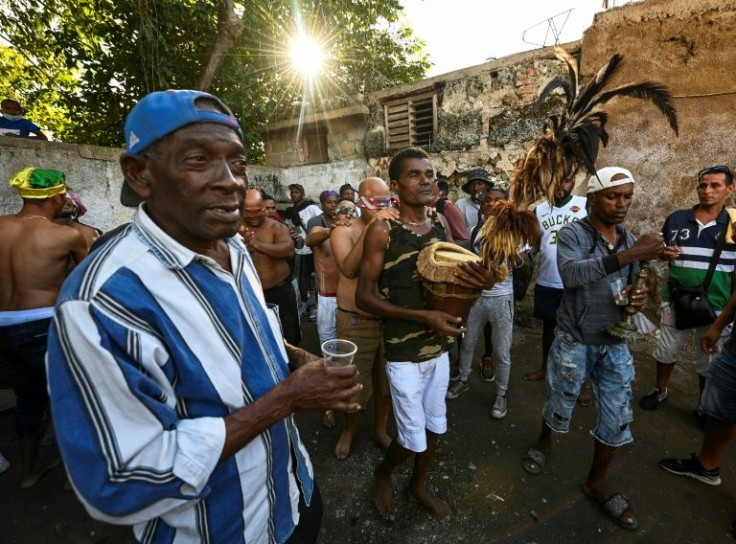 A group of initiates of the Cuban religion Abakua take part in the oath ceremony at the Efi Barondi Cama temple, known as a 'power'