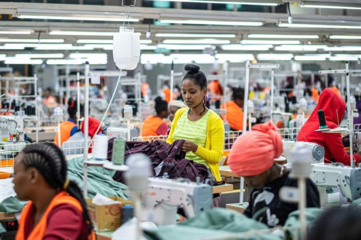 Workers sew clothes in October 2019 at a garment factory in the Hawassa Industrial Park in Ethiopia, which fears a dire impact with the loss of US trading privileges