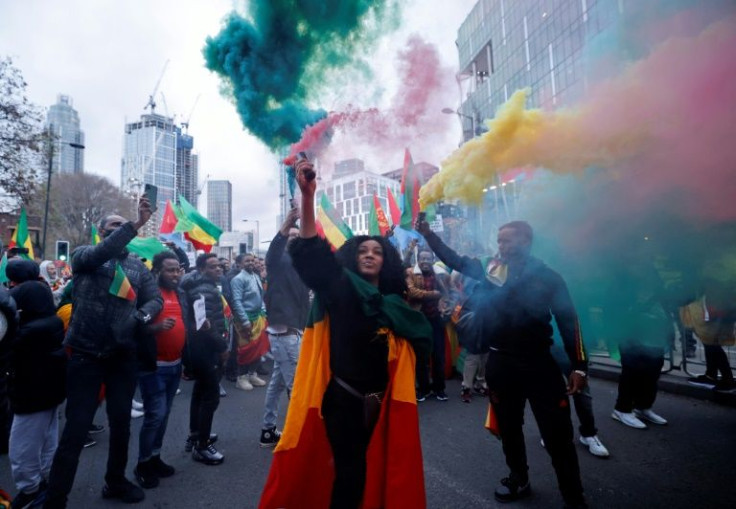Demonstrators hold Ethiopian flags as they protest outside the US embassy in London on November 21, 2021