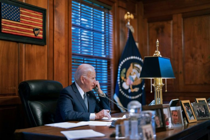 US President Joe Biden seen speaking to his Russian counterpart Vladimir Putin from his home in Wilmington, Delaware on December 30, 2021, in an image provided by the White House