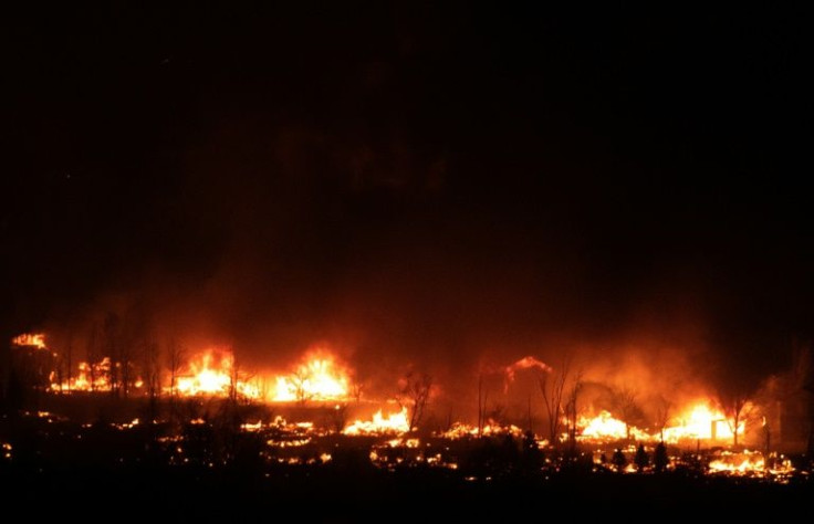 Flames engulf homes as fire spreads through a neighborhood in the town of Superior in Boulder County, Colorado on December 30, 2021