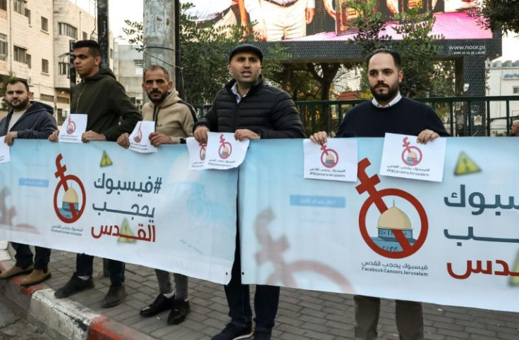 Palestinian activists and journalists protest against what they consider censorship of Palestinian content by Facebook