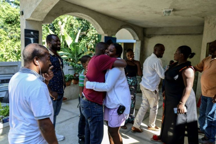 Relatives gather for a traditional lunch on January 01, 2022 in Port-au-Prince, Haiti