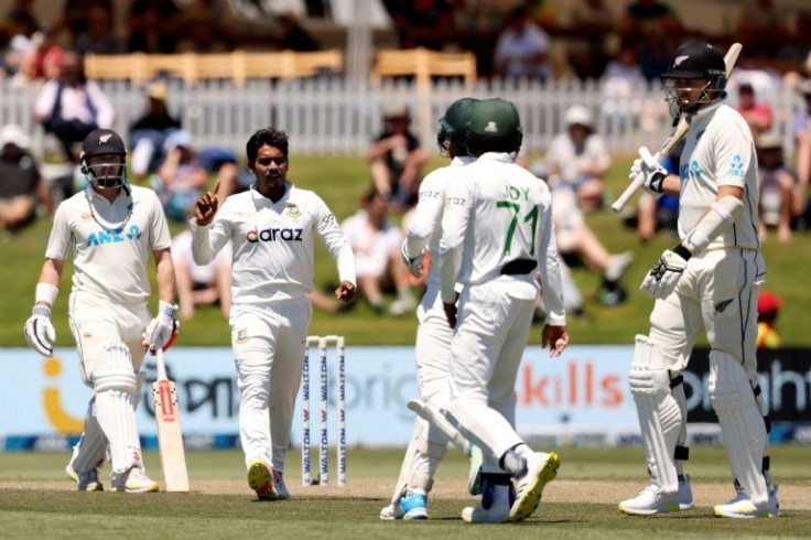 Bangladesh bowler Mehidy Hasan (second right) celebrates the wicket of New Zealand's Tim Southee during the second day of the first Test at Bay Oval in Mount Maunganui