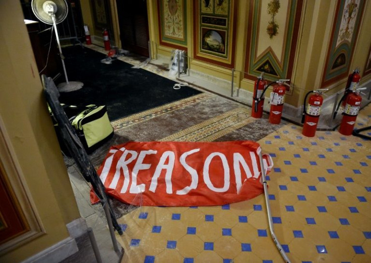 A banner on the floor of the US Capitol a day after the building was stormed by Trump supporters
