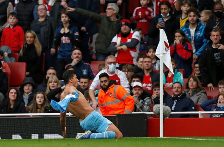 Rodri celebrates Manchester City's 2-1 win at Arsenal