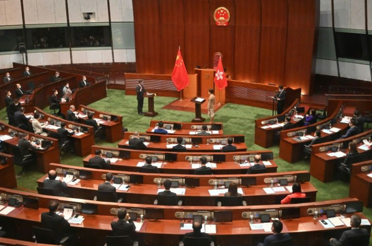In a ceremony laden with symbolism reflecting Hong Kong's new political realities, 90 lawmakers took their oaths
