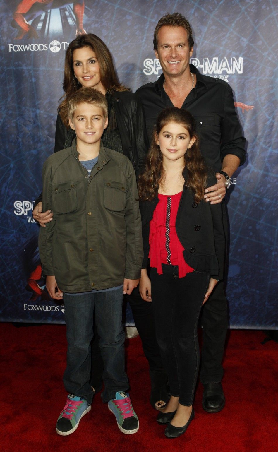 Model Cindy Crawford, her husband Rande Gerber, and their children, Presley Walker Gerber front L and Kaia Jordan Gerber, arrive at the Broadway opening of quotSpider-Man Turn Off The Darkquot in New York June 14, 2011.