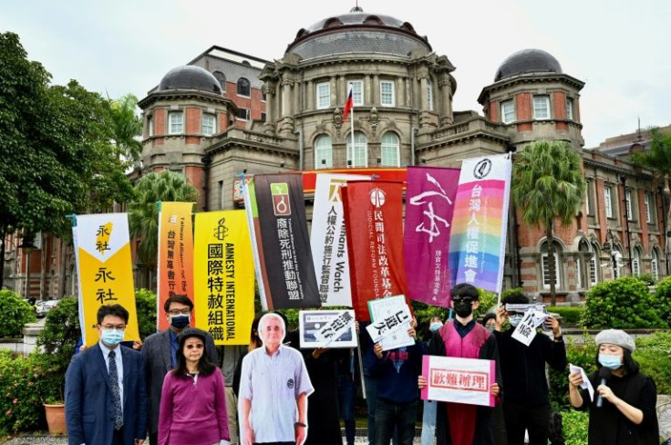Activists have launched a campaign to exonerate Wang Xin-fu (shown as a full-size cutout C), Taiwan's oldest death row inmate