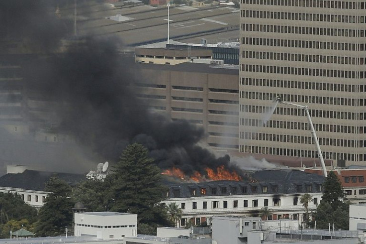 Flames rose from the building on Monday, fanned by strong winds