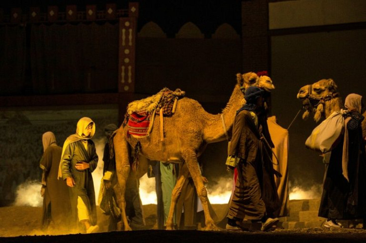 The play, billed as a joint production between Iraqi and Iranian artists, features 140 actors, special effects, and even horses and camels