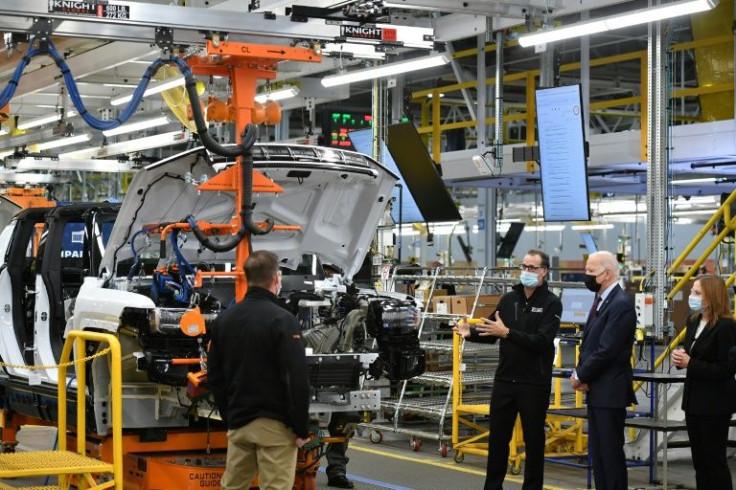 General Motors CEO Mary Barra, shown here with President Biden in November, has unveiled a new all-electric Silverado pickup truck