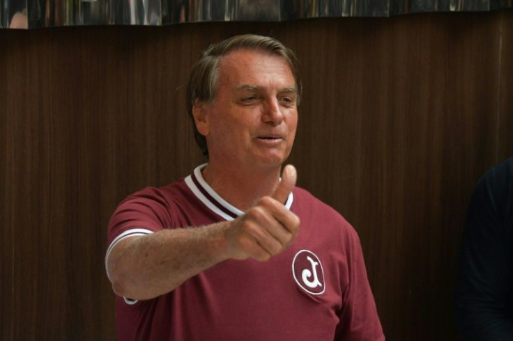 Brazil's President Jair Bolsonaro gestures during a press conference at the Vila Nova Star Hospital after he was discharged, in Sao Paulo, Brazil, on January 5, 2022