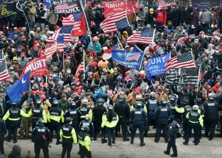Donald Trump supporters clash with police and security forces as they storm the US Capitol in Washington on January 6, 2021