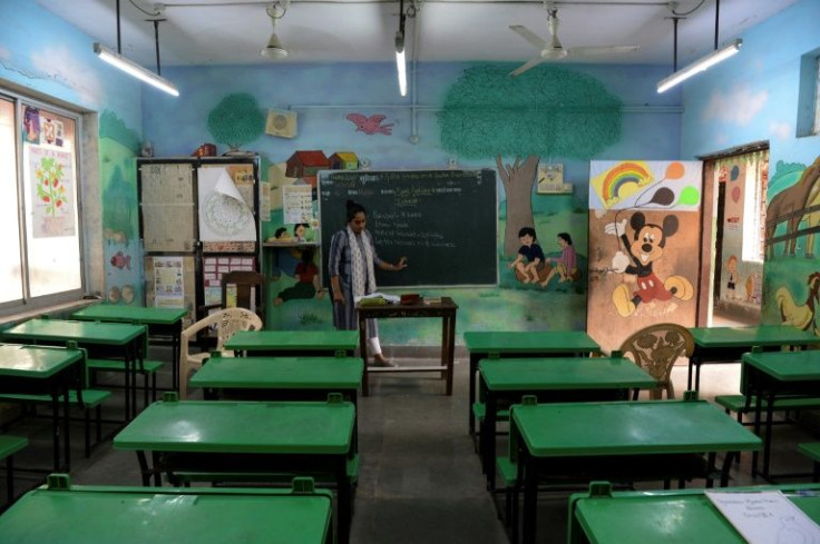 A teacher conducts an online class in an empty classroom as schools remained closed in Mumbai