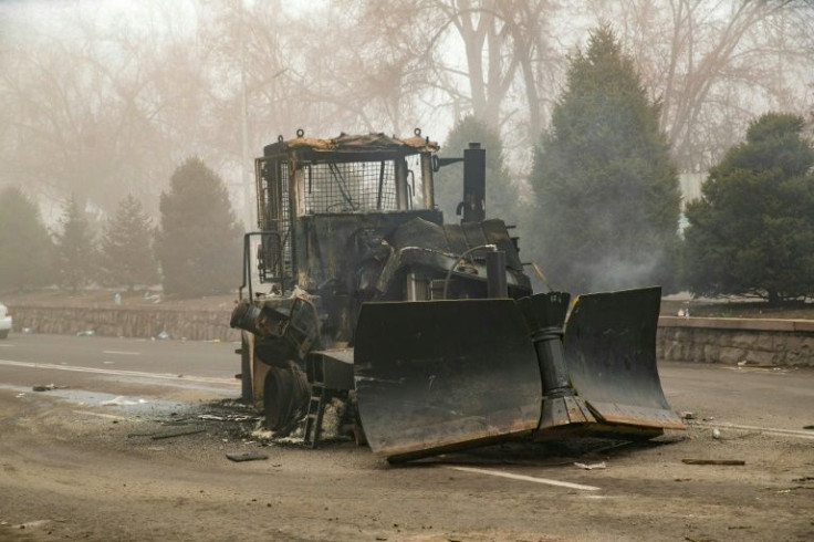 Burn-out vehicles littered the streets