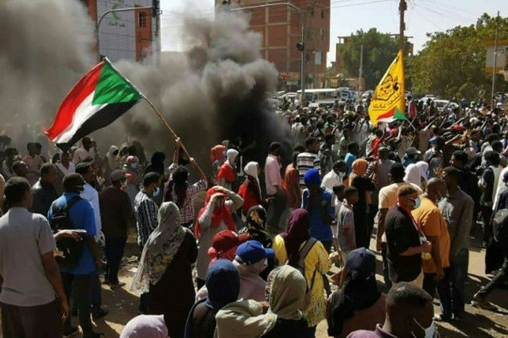 Protesters set fire to tyres to create burning barricades