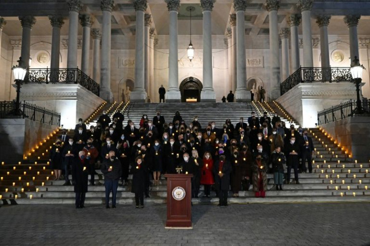 Democratic members of the US Congress take part in a prayer vigil on the first anniversary of the assault on the US Capitol, on the East Steps of the Capitol in Washington, DC on January 6, 2022