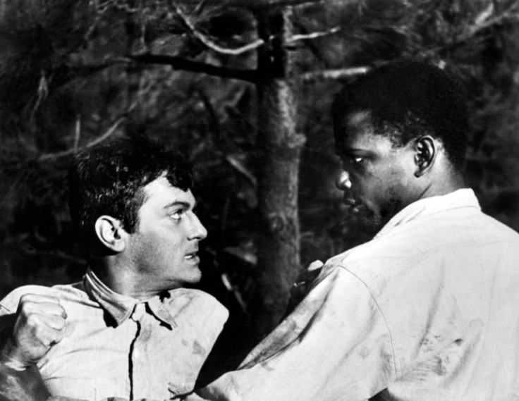 Poitier (R) starred with Tony Curtis (L) in the movie "The Defiant Ones" directed by Stanley Kramer