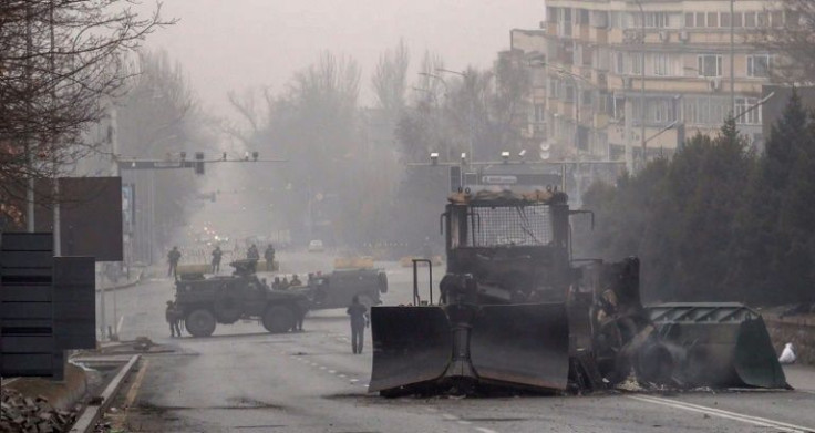 Rescue service vehicles positioned concrete blocks as checkpoints in Almaty