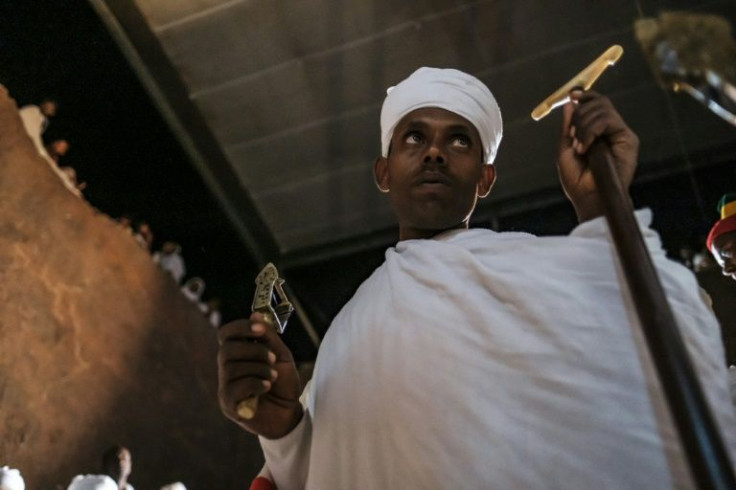 A priest attends a celebration at Saint Mary's Church on the eve of Genna, the Ethiopian Orthodox Christmas