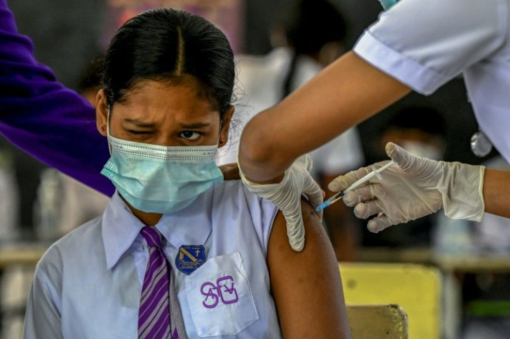 Omicron's dizzying spread has prompted many nations to push harder for more vaccinations