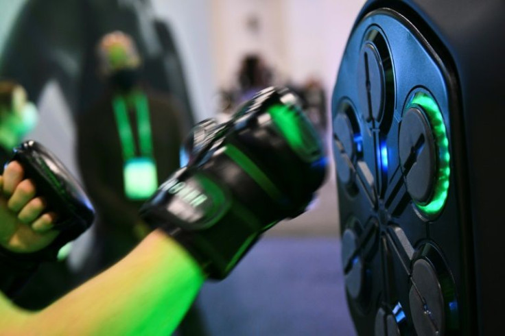 An attendee uses a Liteboxer interactive boxing home workout during the Consumer Electronics Show (CES) on January 7, 2022 in Las Vegas, Nevada