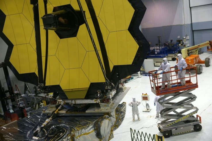 In this file photo taken on November 02, 2016, engineers and technicians assemble the James Webb Space Telescope at NASA's Goddard Space Flight Center in Greenbelt, Maryland