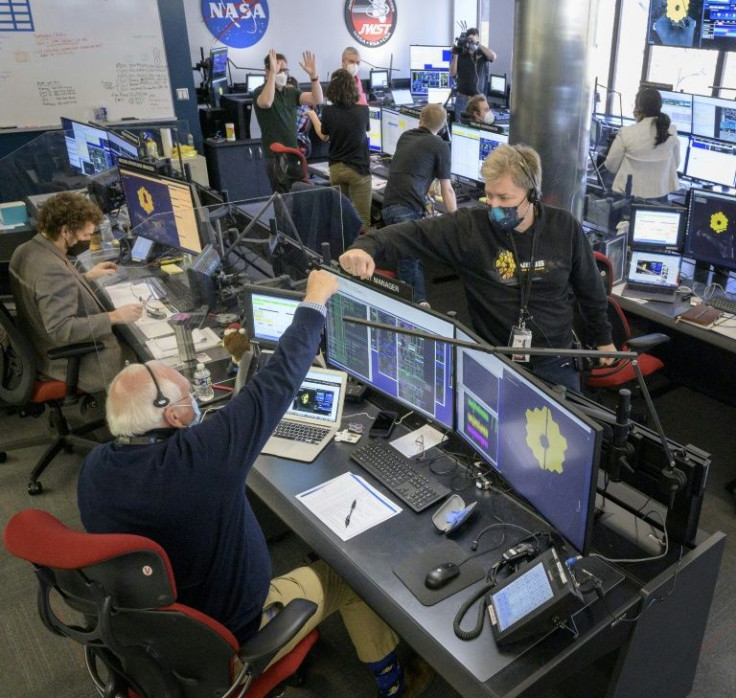 NASA engineering teams celebrate at the Space Telescope Science Institute in Baltimore, Maryland