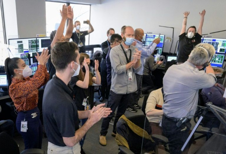 The James Webb Space Telescope mission operations team celebrates on January 8, 2022, at the Space Telescope Science Institute in Baltimore, Maryland, after confirming that the observatoryâs final primary mirror wing successfully locked into place