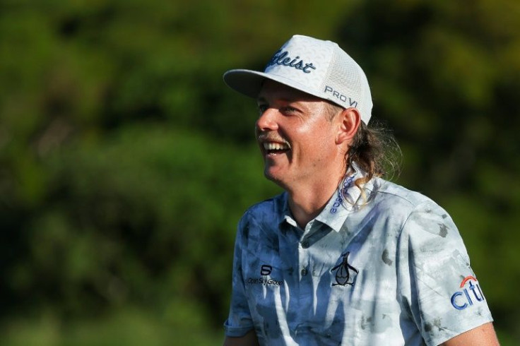 Australian Cameron Smith smiles after making a birdie at 17 on the way to a share of the third-round lead in the PGA Tour Tournament of Champions in Hawaii