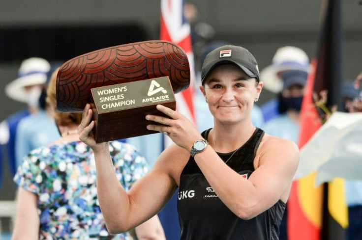 Ashleigh Barty of Australia celebrates with the trophy after winning against Elena Rybakina of Kazakhstan in the women's singles final match at the WTA Adelaide International tennis tournament in Adelaide on January 9, 2022.