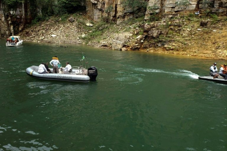 Tourists flock to see the cliffs, caverns and waterfalls that surround the green waters of Lake Furnas in Brazil