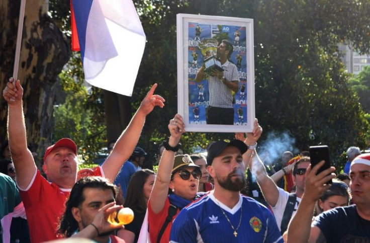 Members of the local Serbian community rally outside a government detention centre where tennis champion Novak Djokovic is staying