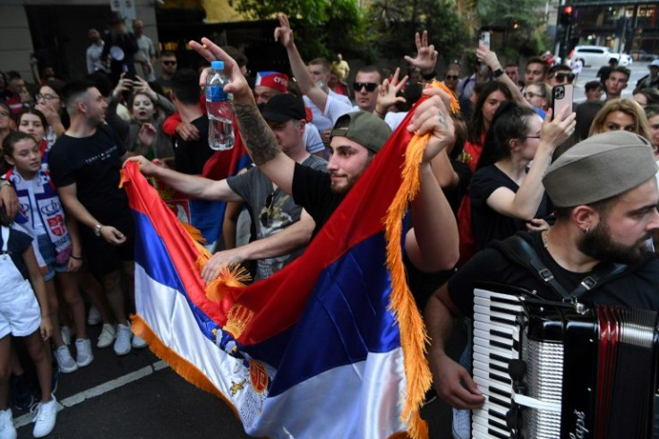 The Serbian superstar left the detention centre as celebrating fans sang and danced, his cancelled visa restored by a court
