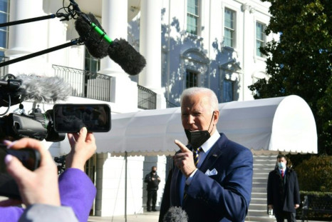 President Joe Biden said US democracy faces a 'defining' moment as he left the White House for Georgia